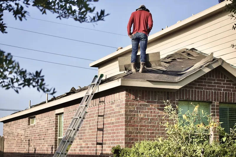 Professional roofer working on a residential roof in Texas